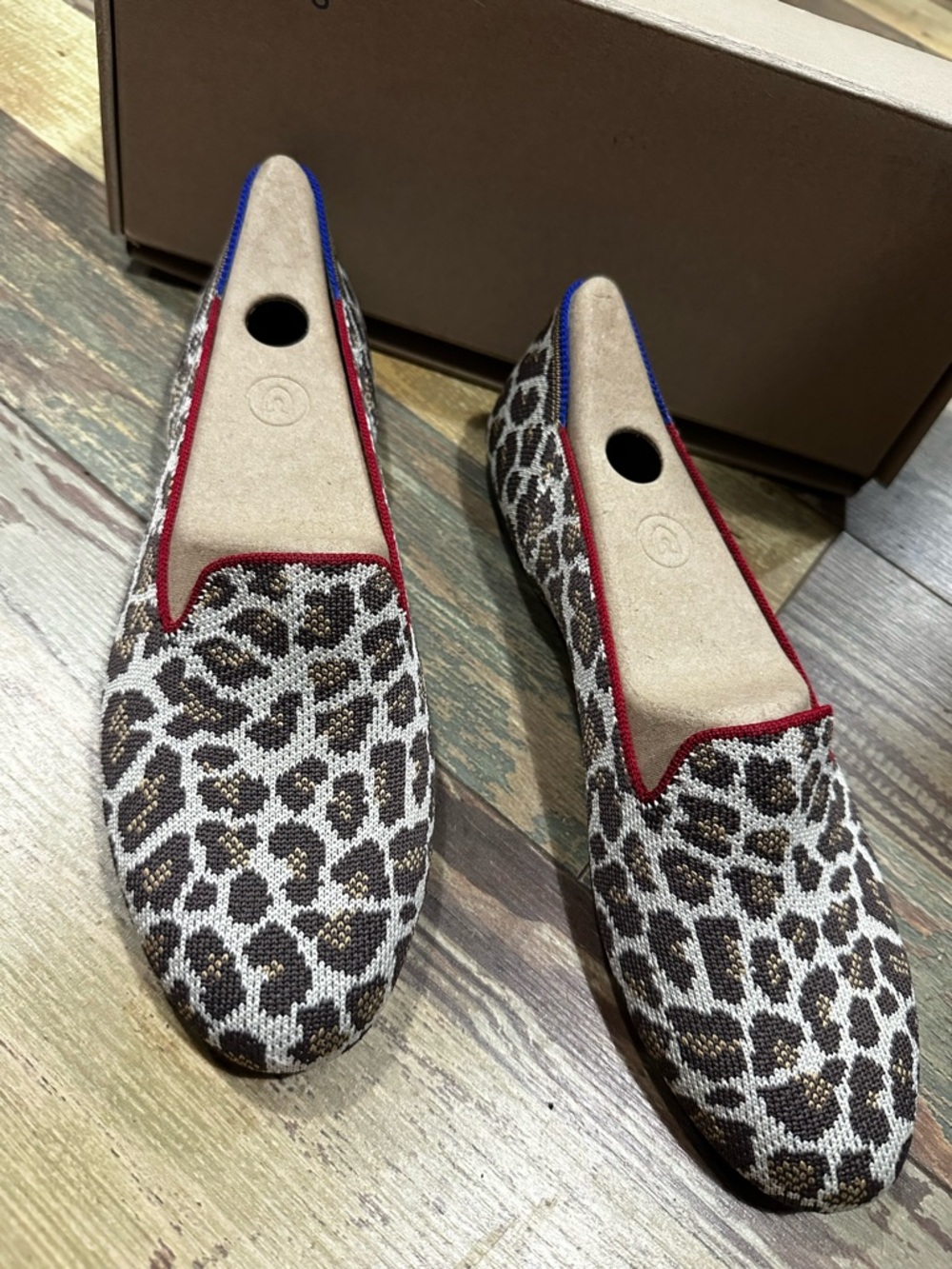 Rothy's Leopard Print Slip-On Flats with Red and Blue Trim